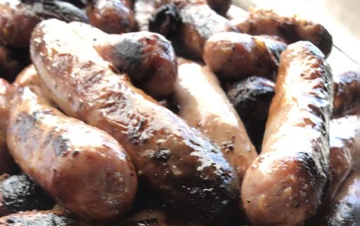 BBQ sausages ready for serving at a wedding